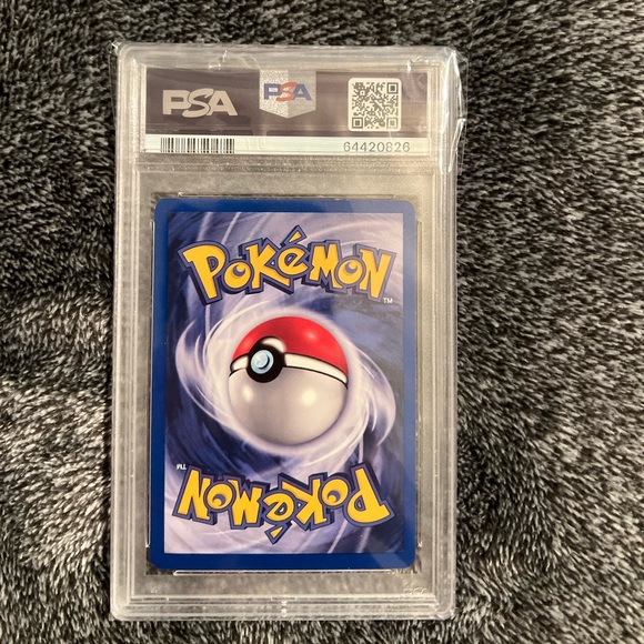 Pokémon Houndoom- Holo 1st Edition 4/75 2001
P.M. Neo Discovery PSA Rating: 7 - Picture 2 of 2